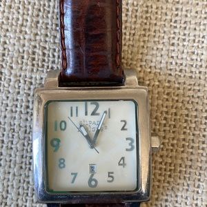 Silpada men’s-style watch, stainless steel with brown leather band.